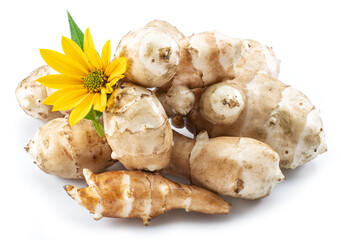 Jerusalem artichoke roots with leaves and flower of Jerusalem artichoke isolated on white background.