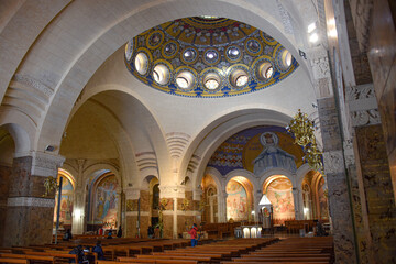 Fototapeta na wymiar Lourdes, France - 9 Oct, 2021: Interior views of the Basilica Sanctuary of Our Lady of Lourdes