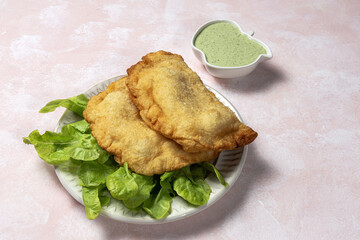 Homemade fried Neapolitan pizza with ham and cheese