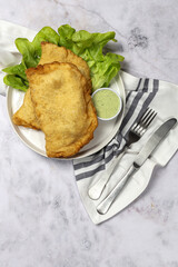 Homemade fried Neapolitan pizza with ham and cheese