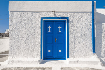 Blue wooden door with white wall background