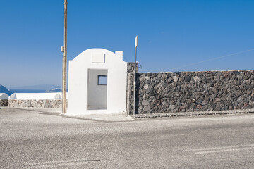 White building for bus stop in Santorini Island, Greece