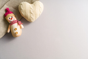Christmas decoration Crochet Heart and fabric snowman on Winter and Christmas background with linen fabric decor