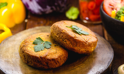 alternative burger made from vegetables, carrots, wholemeal flour and quinoa, with various...