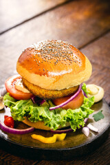 vegan burger made with milk-free bread, carrot burger, quinoa and vegetables. Gluten-free vegetarian snack