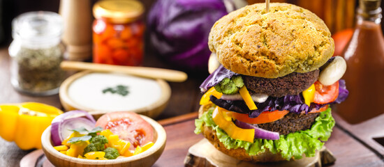Vegan black bean and beet burgers made with quinoa and rice, kale, lettuce, tomato, mushrooms. Gluten-free herbal food concept