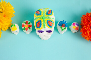 Sweet mexican sugar skulls and marigold flowers. Day of the dead concept