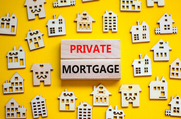 Private mortgage symbol. Concept words 'Private mortgage' on wooden blocks near miniature wooden houses. Beautiful yellow background. Business, private mortgage concept.