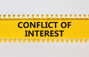 Conflict of interest symbol. White and yellow paper with words 'conflict of interest'. Beautiful...