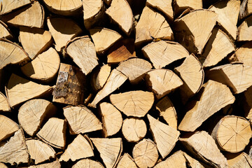 closeup of wood piled up on a wall waiting to be used for the fireplace while the could winter season of Navarra, Spain