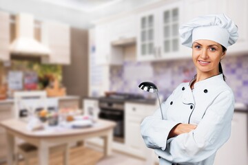 cheerful lady holding kitchen wares, food concept