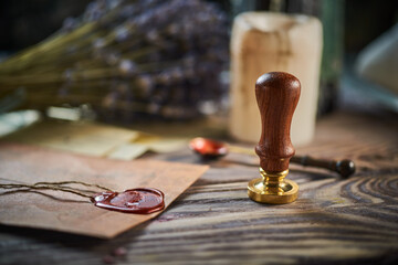 Sealing wax on ancient papers, antique stamp, and old documents, brass spoon 