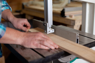 Joinery. Close-up workers. The carpenter measures with a ruler and draws with a pencil. Tree. Ecological compatibility. Lifestyle. 