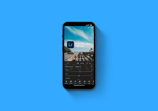 Adobe Photoshop Lightroom Mobile app on iPhone 13 Pro smartphone screen on blue background. Creative image organization and image manipulation app. Rio de Janeiro, RJ, Brazil. October 2021