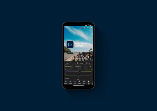 Adobe Photoshop Lightroom Mobile app on iPhone 13 Pro smartphone screen on blue background. Creative image organization and image manipulation app. Rio de Janeiro, RJ, Brazil. October 2021.