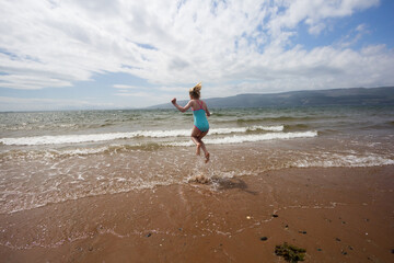 Child playing on the beach