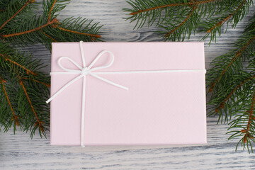 A gift parcel with christmas decoration, branch of fir, presents for the holiday, empty copy space