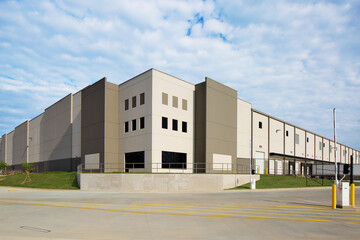 Fototapeta na wymiar Entrance of generic gray warehouse distribution facility