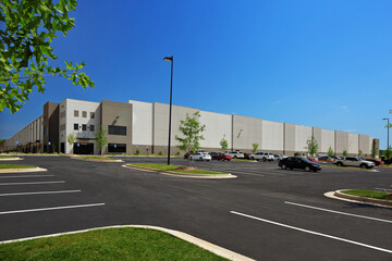 Warehouse distribution center parking lot under blue sky