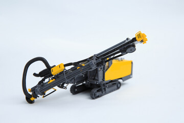 Fototapeta premium Natural scale model of a contour drill rig on a white background