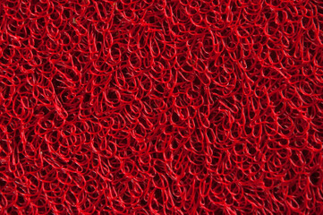 red rug. purple unusual background. fuzzy creative surface	