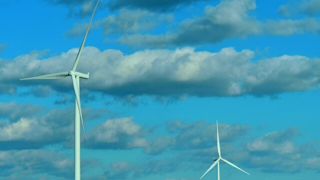 Wind Turbines clouds in sky
