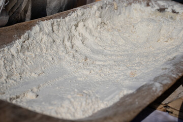 Wheat flour in a wooden traditional tub