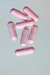 Assorted pharmaceutical capsules. Heap of various pills on a whi