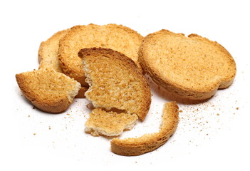 Broken rusks pile, broken pieces with crumbs isolated on white  