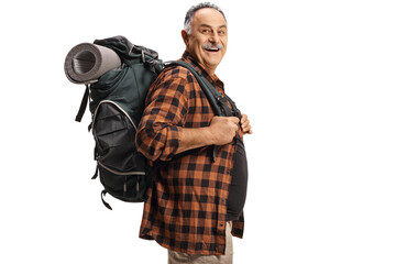 Mature hiker carrying a backpack and smiling
