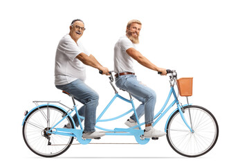 Young and mature man riding a tandem bicycle