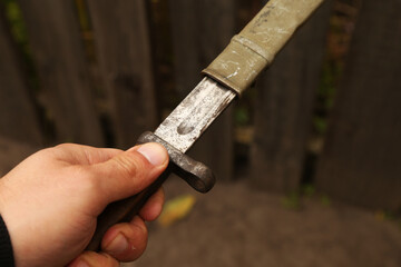 Vintage bayonet knife in the hand