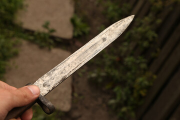 Vintage bayonet knife in the hand