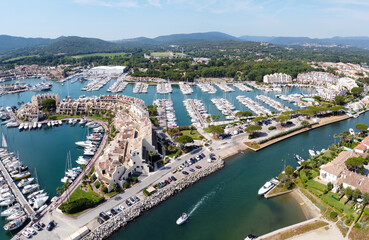 Fototapeta premium Aerial view on small houses and sailboats of Port Grimaud and port Cogolin, French Riviera, Provence, France