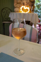 Summer on French Riviera Cote d'Azur, drinking cold rose from Cotes de Provence on outdoor terrase in old cafe, Var, France