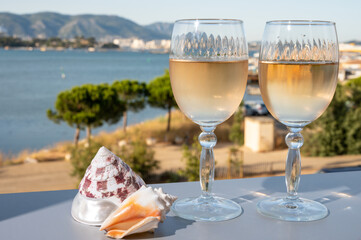 Summer on French Riviera, drinking of cold white or gris rose wine from Cotes de Provence on...