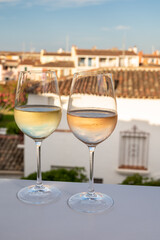 Summer on French Riviera Cote d'Azur, drinking cold rose and white wine from Cotes de Provence on outdoor terrase in Port Grimaud, Var, France