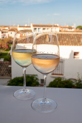 Summer on French Riviera Cote d'Azur, drinking cold rose and white wine from Cotes de Provence on outdoor terrase in Port Grimaud, Var, France