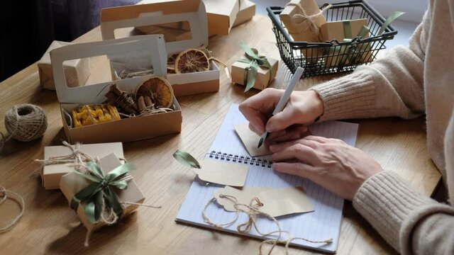 Christmas gift. gift box,zero waste, eco friendly hand made box packaging gifts in kraft paper table, eco christmas holiday concept, Christmas gift wrapping,eco decor