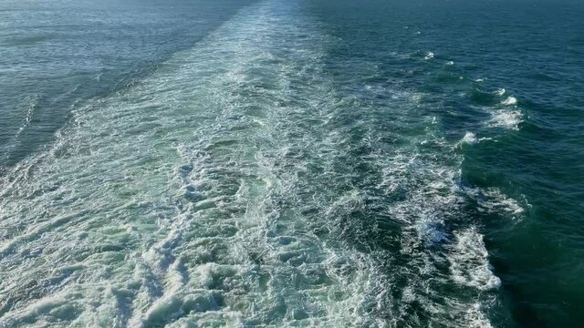 A Cruise ship wake on a beautiful turquoise and blue seas