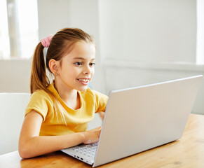 child laptop computer technology home girl education homework kid learning internet childhood student sitting connection using online