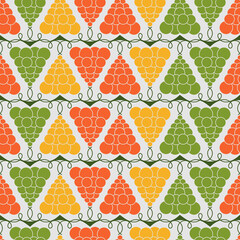 Seamless pattern with red, yellow and green grapes on white background. Colorful endless texture in vector