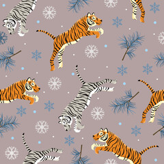Fototapeta na wymiar Seamless pattern with tigers with snowflakes and pine twigs. New year 2022 animalistic pattern. Christmas festive template for wrapping paper, cards, textiles.