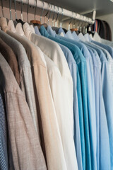 Stockholm, Sweden Pressed dress shirts hanging in a closet.