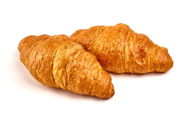 Freshly baked croissants, isolated on white background.