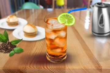 Cold black coffee with ice cubes on a desk. Summer drinks.