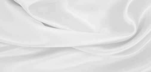 Smooth elegant white silk or satin luxury cloth texture as wedding background. Luxurious background design