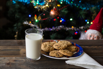 Father Christmas toy watching the cookies and the glass of milk.