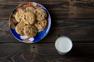 Top view of a cookies end glass of milk