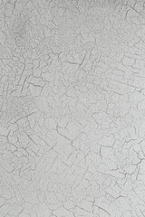 Backdrop of cracked white plaster on the wall - illustration of dry skin
